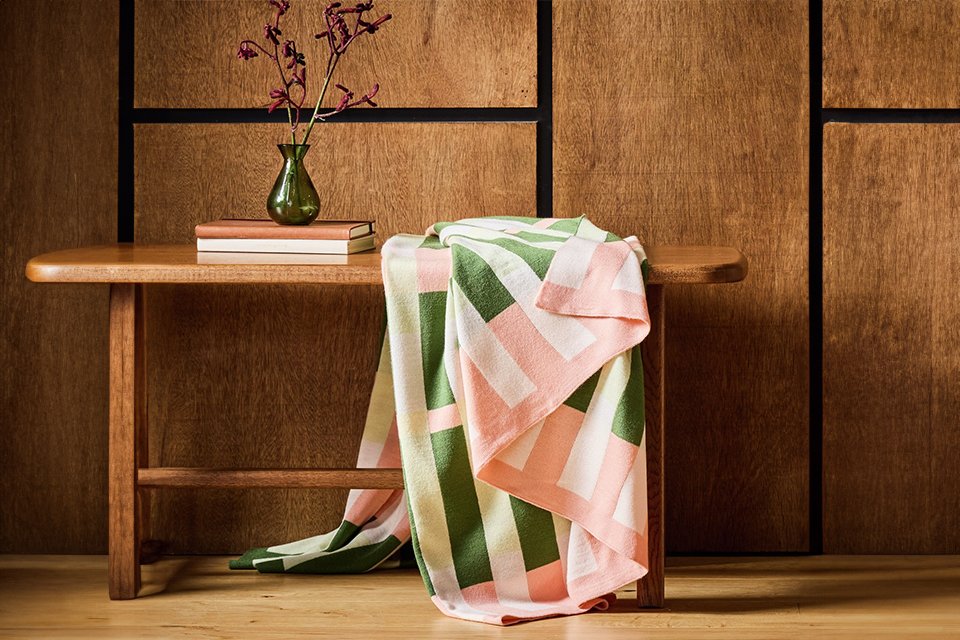 A pink & green Habitat midcentury knitted throw.